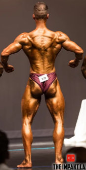 Rear relaxed bodybuilding pose